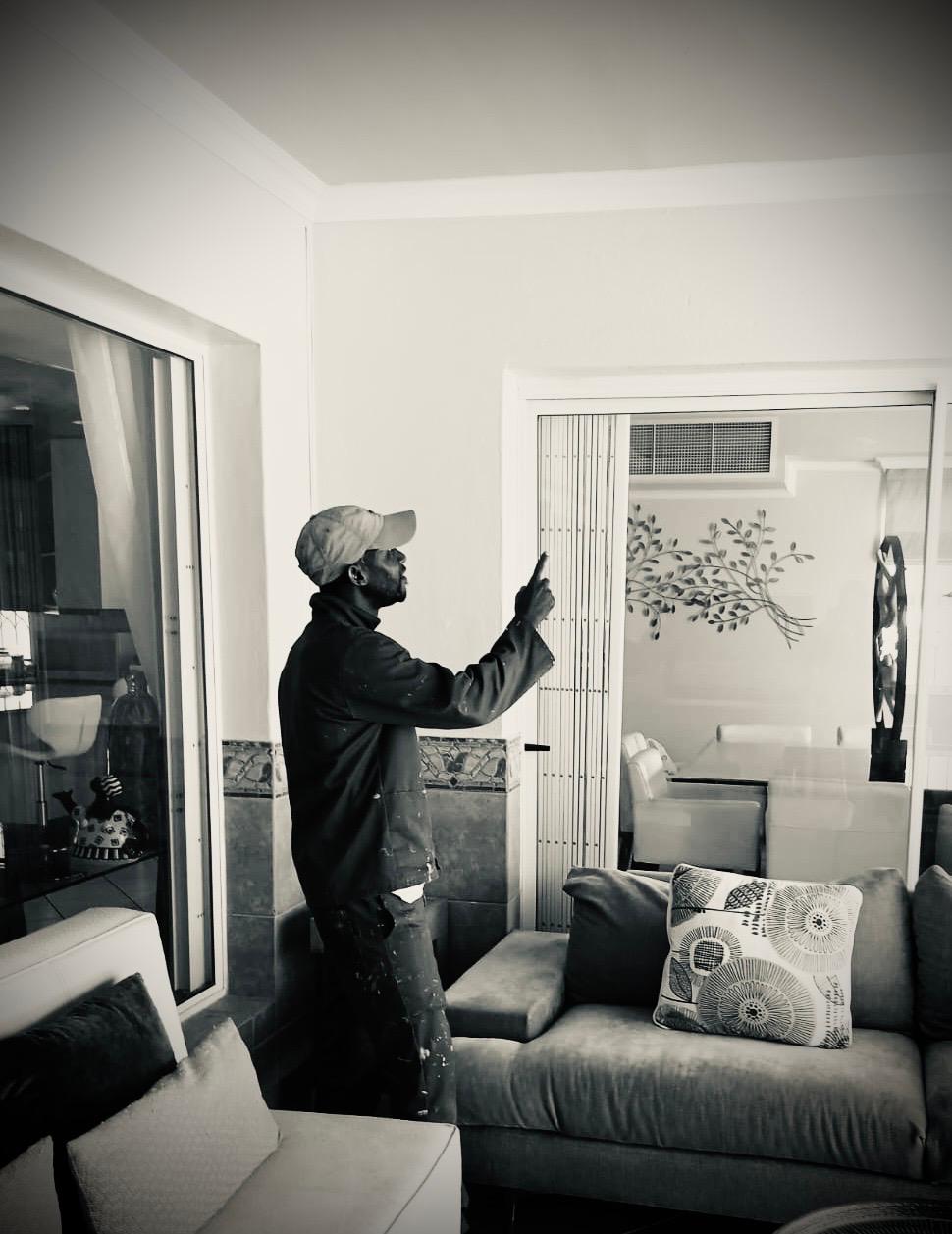 Hands-on maintenance of an interior fitting beside a living area